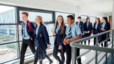 Pupils walking in school corridor