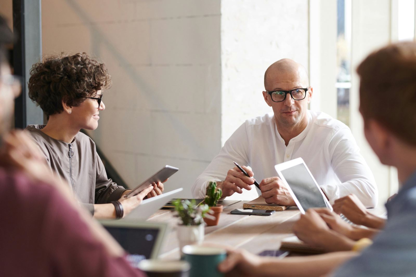 Business meeting with people round a table