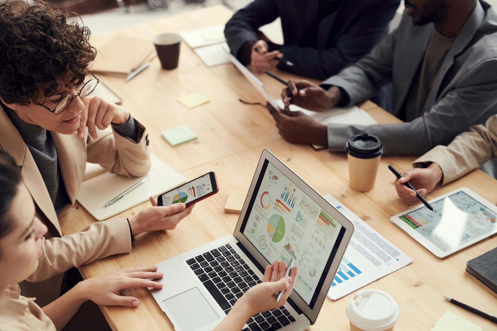 Image of business people around a table 