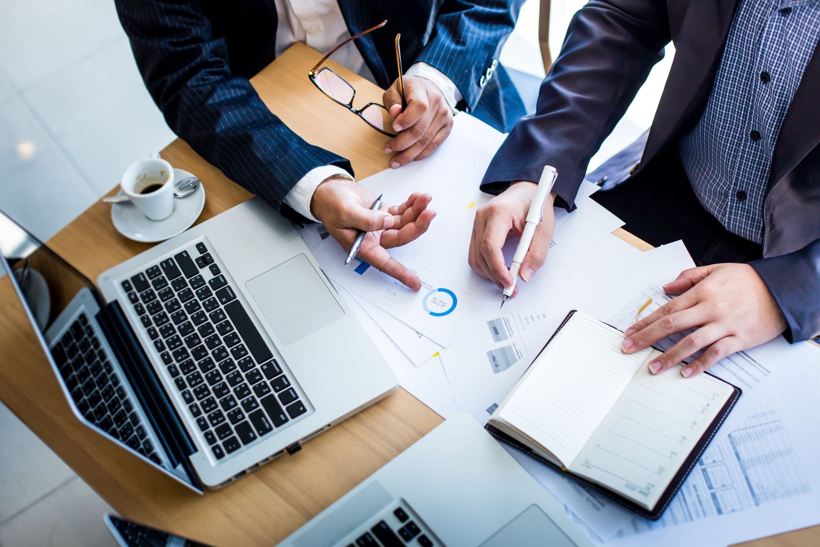 Business Meeting - top shot of people round a desk