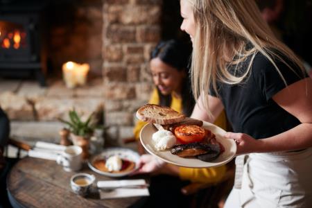 Person serving food in a restaurant