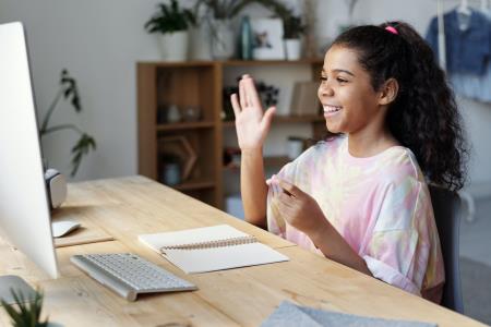 young girl working at computer
